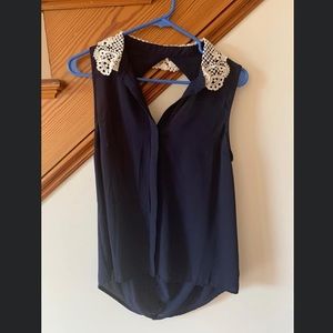Navy blue Chloe K brand tank with crochet detail around collar. Size small.
